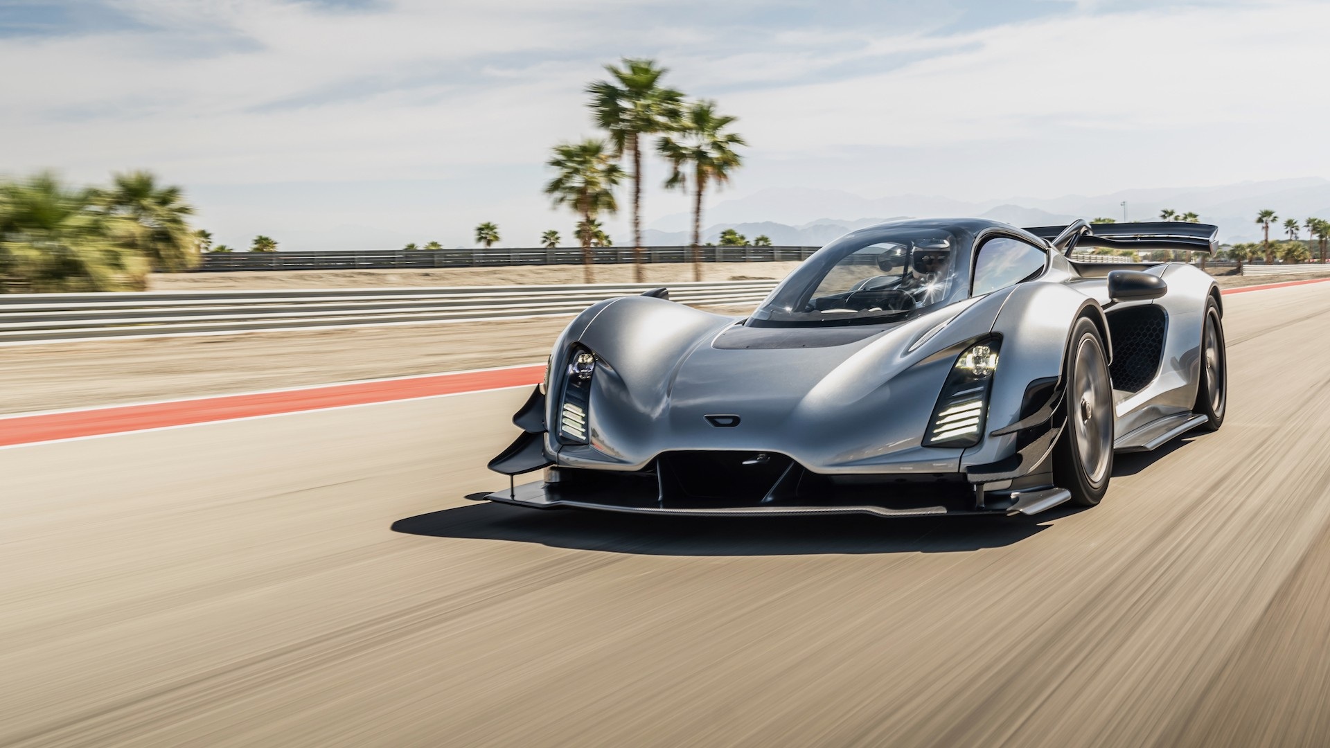 Dynamic shot covering the front three quarters of a Silver Czinger 21C