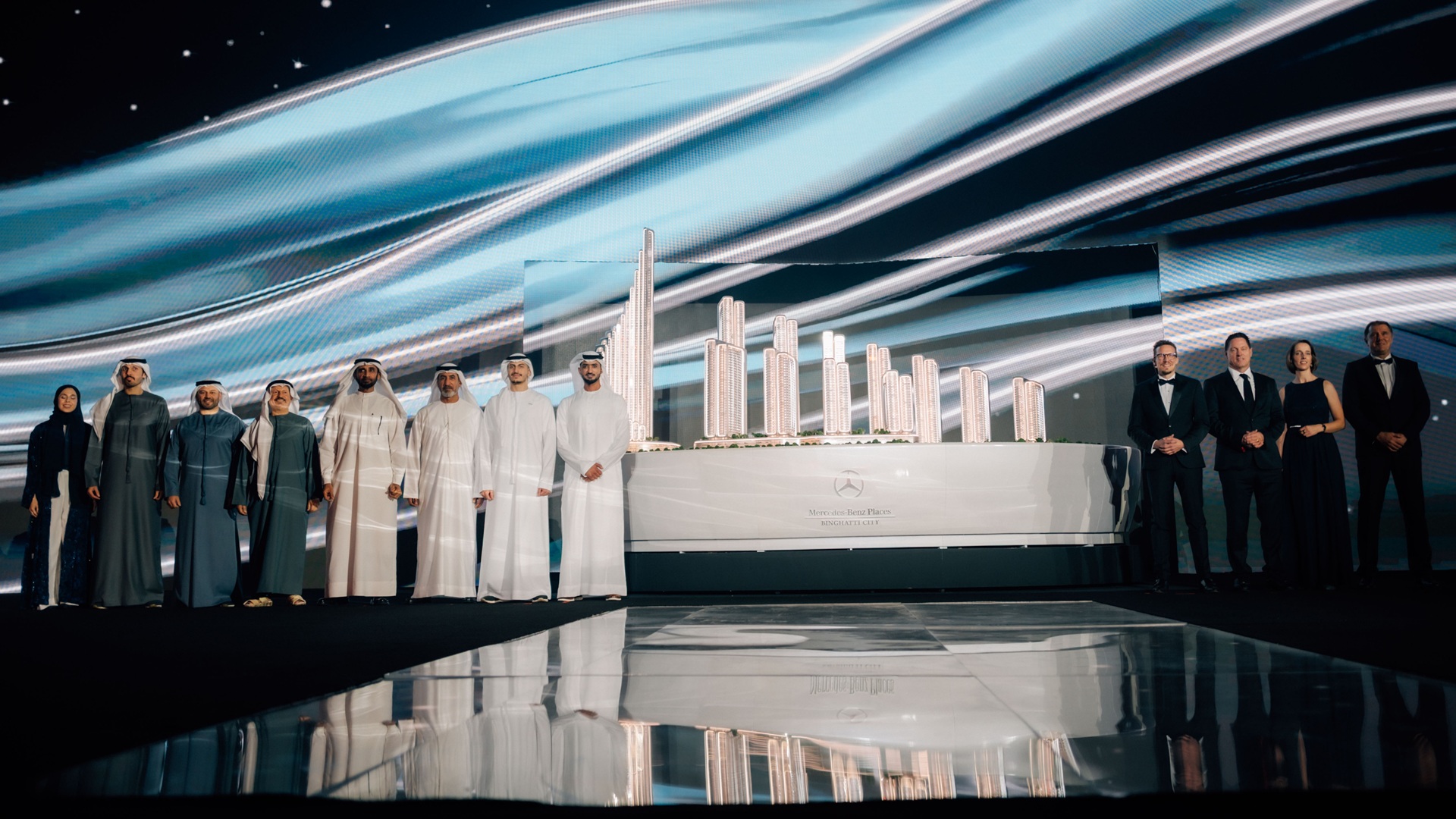 With a model of Mercedes-Benz Places | Binghatti City behind, the teams from Mercedes-Benz and Binghatti on stage
