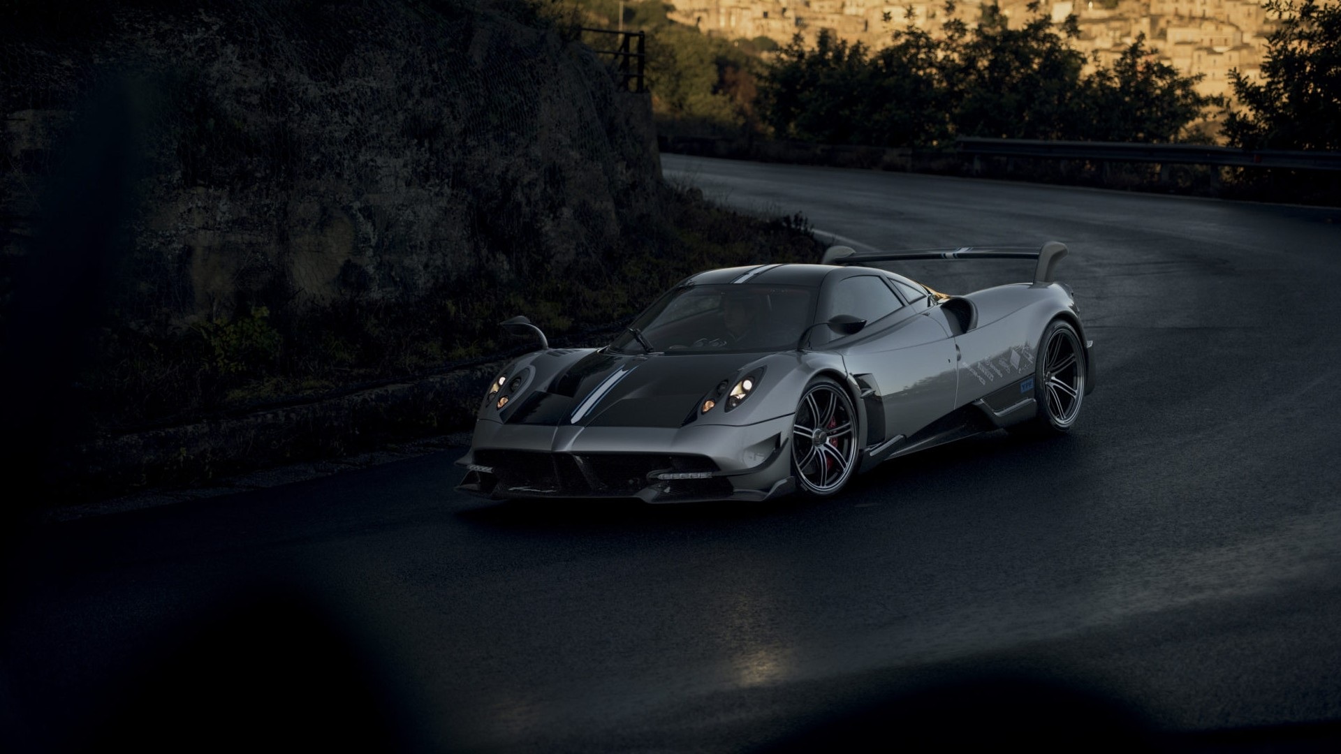 Grey Pagani Huayra BC taking a bend