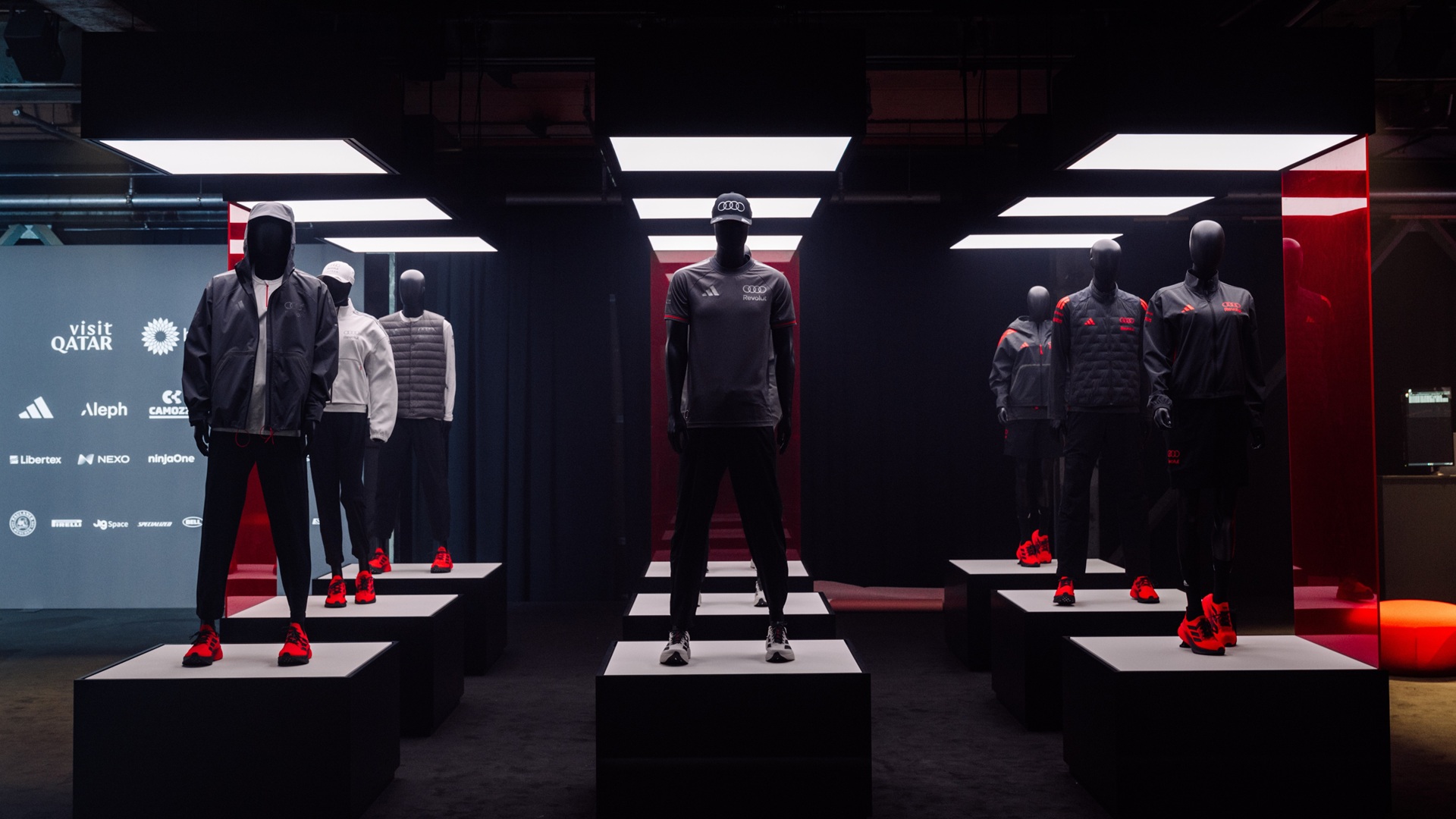 Mannequins with select apparel from the adidas x Audi Revolut F1 Team fanwear range