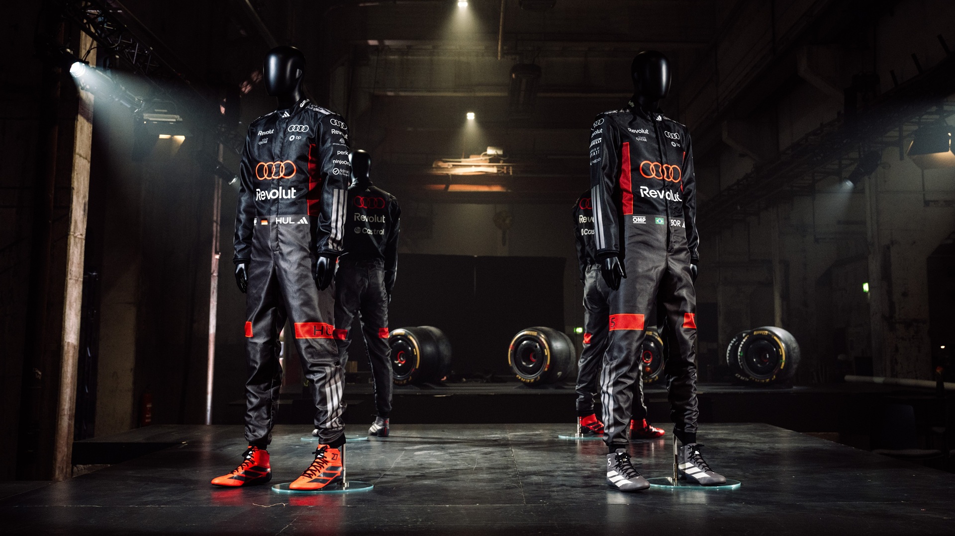 Mannequins with select apparel from the adidas x Audi Revolut F1 Team teamwear range