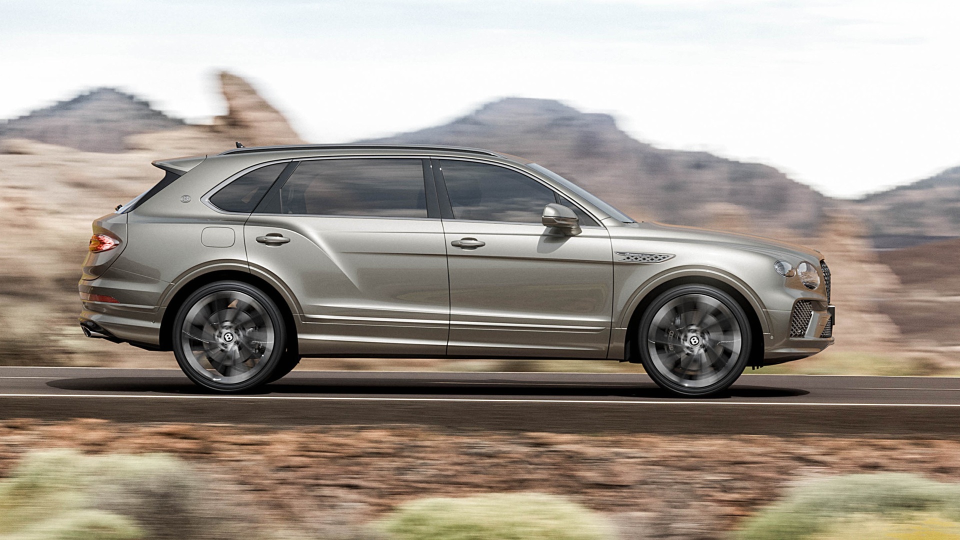 A dynamic photograph covering the entire profile of the Bentley Bentayga Artenara