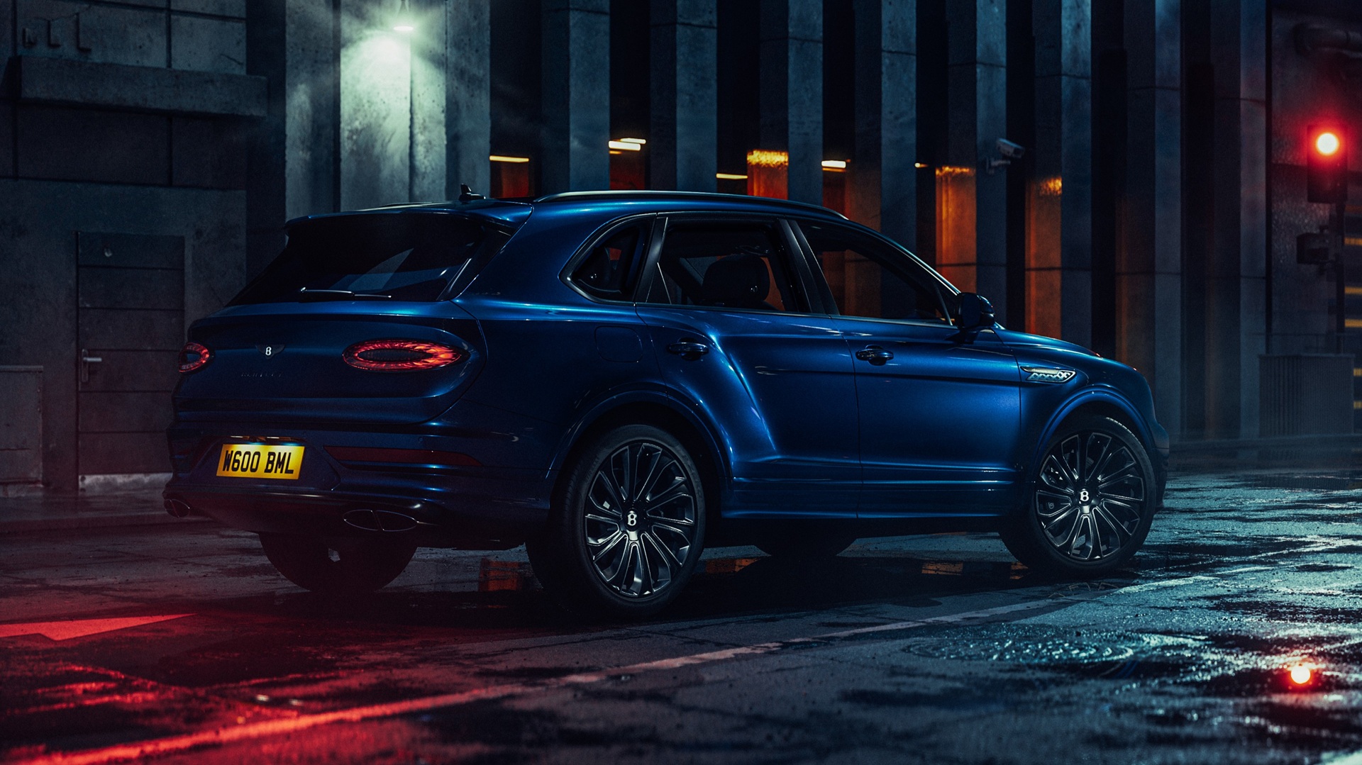 Static image covering the rear three-quarters of a Sequin Blue Bentley Bentayga Artenara