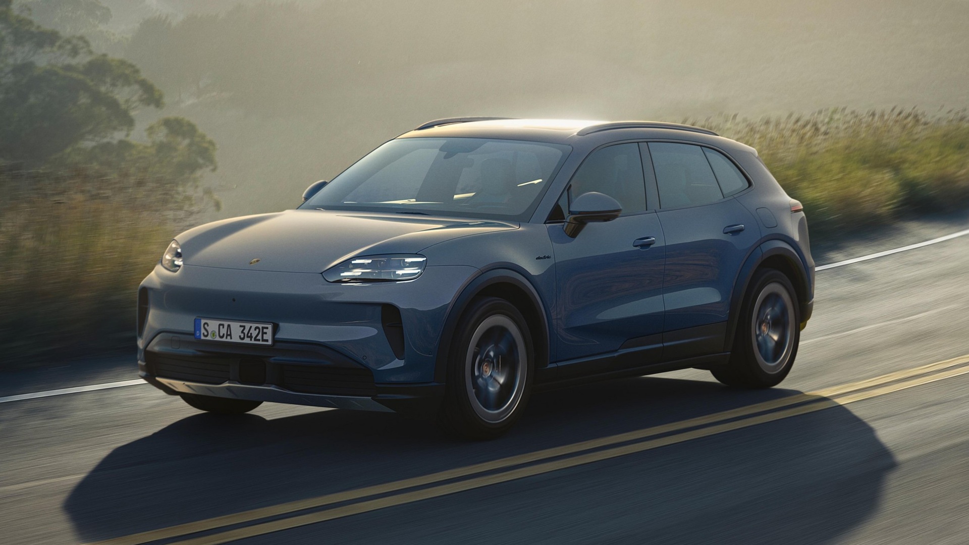 Dynamic shot covering the front three-quarters of the new Porsche Cayenne S Electric