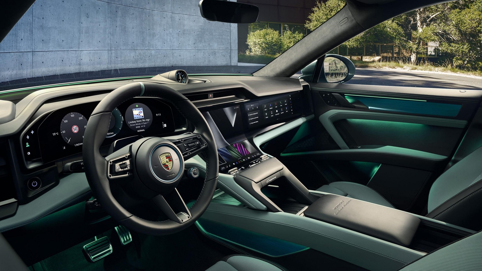 Side shot of the entire dashboard of the new Porsche Cayenne S Electric with Mystic Green Interiors