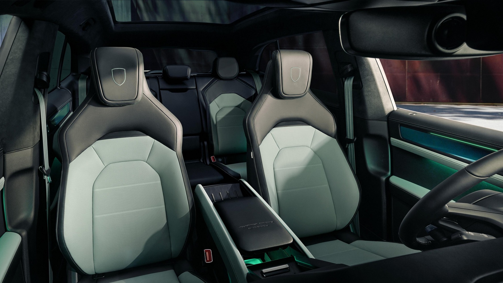 Wide shot of the front seats of the new Porsche Cayenne S Electric with Mystic Green Interiors
