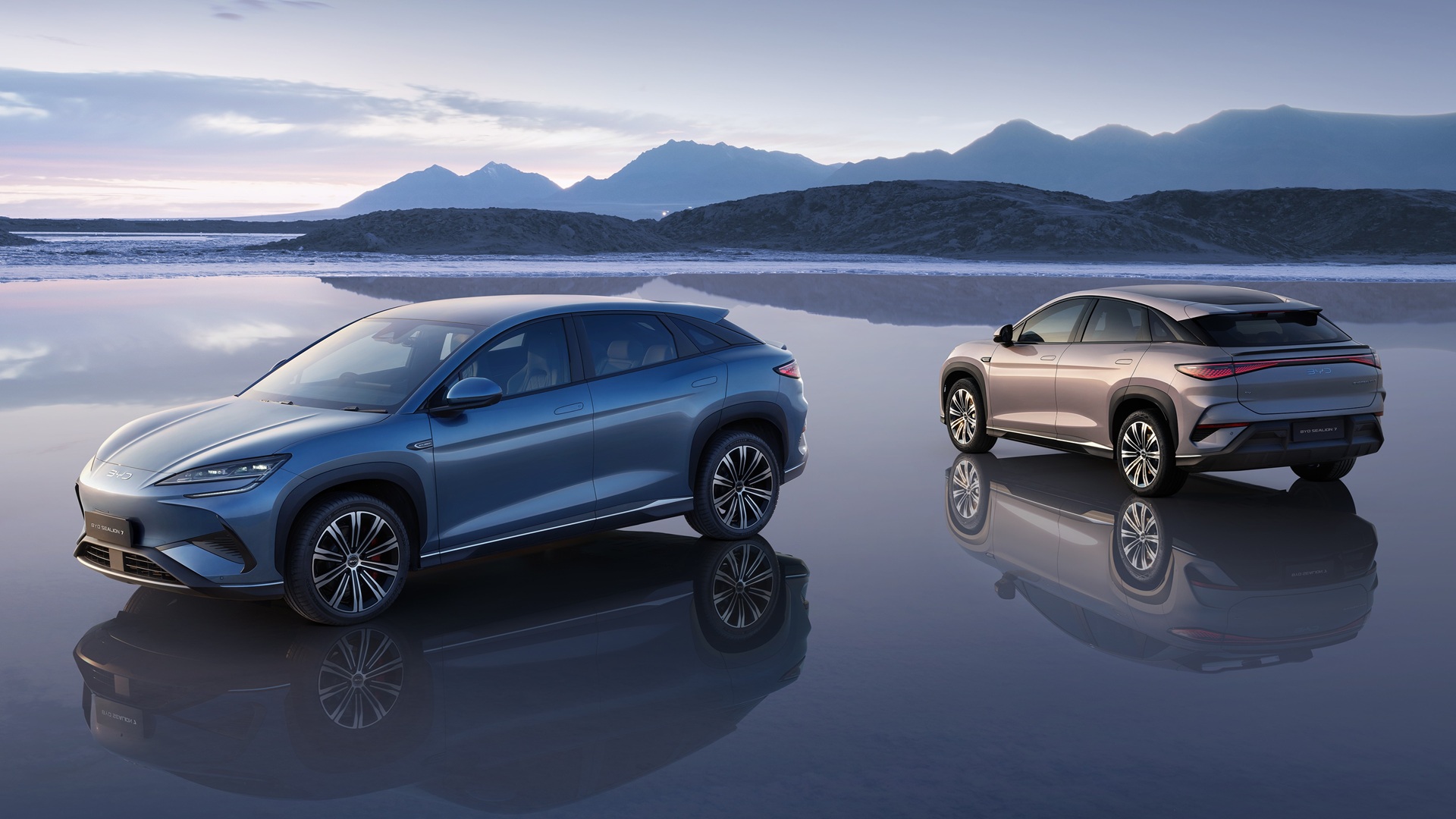 Brand image - two BYD Sealion 7 models parked with a scenic view.