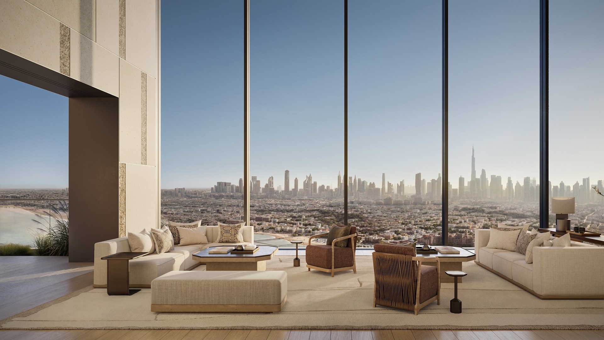 The living room of the five-bedroom residence, with a daytime view of the city's skyline, at Aman Dubai