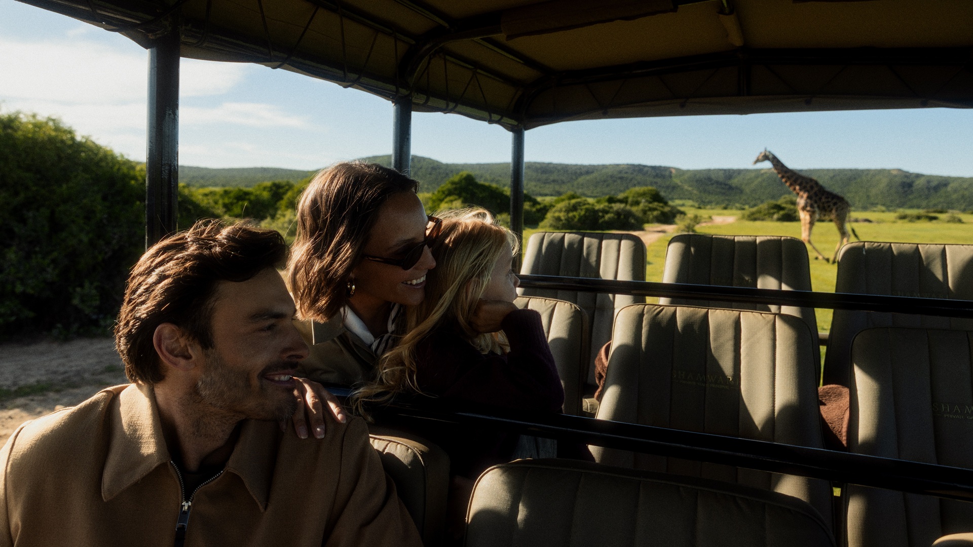 Guests observing animals on a guided game drive at the Shamwari Private Game Reserve.