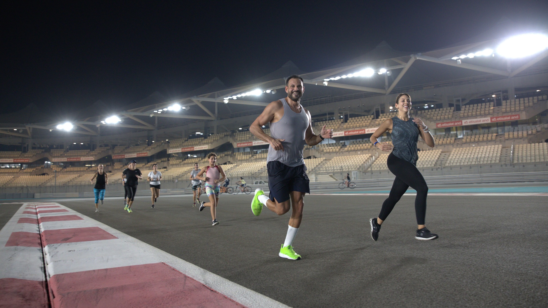People running on the Yas Marina Circuit