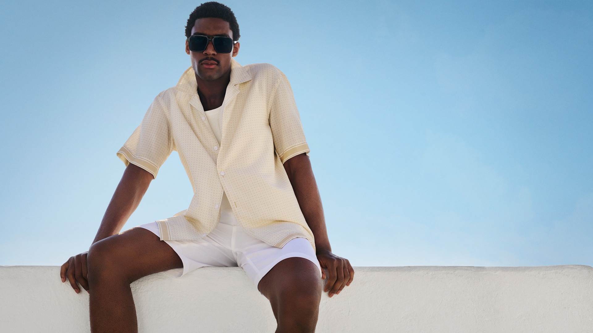 A model wearing select pieces from the BOSS Summer Resort 2026 Collection