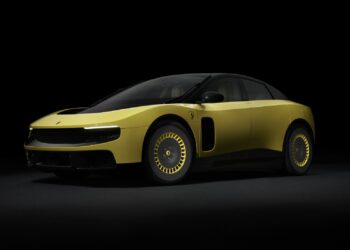 A studio shot of the Ferrari Luce in Giallo Luce shade, taken from the front-left side