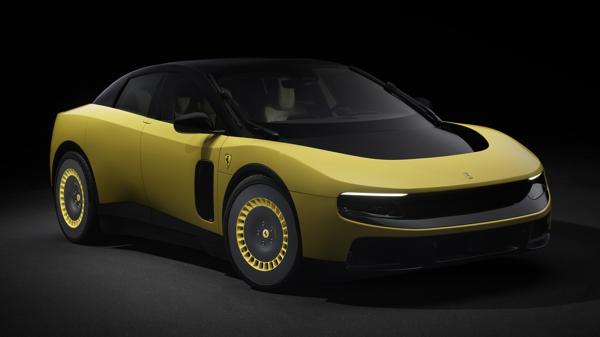 A studio shot of the Ferrari Luce in Giallo Luce shade, taken from the front-right side