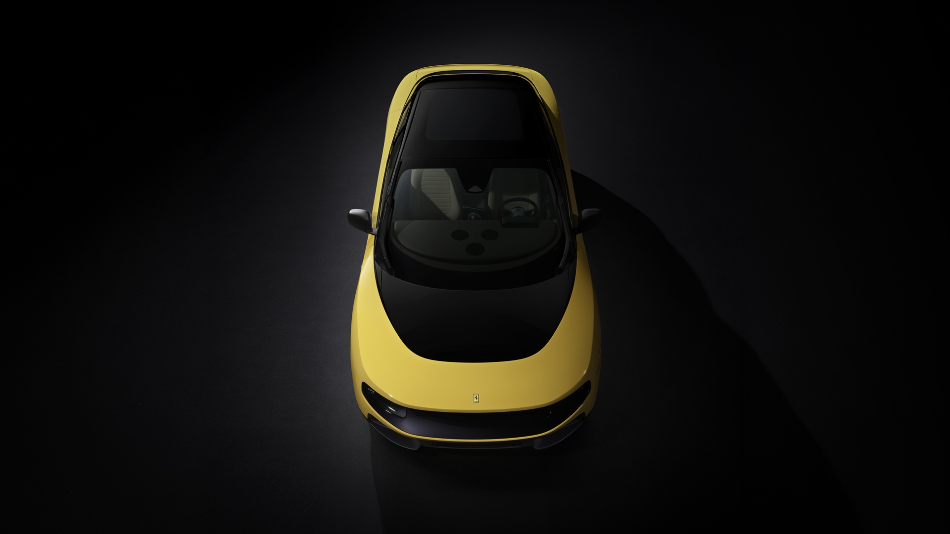 A studio shot of the Ferrari Luce in Giallo Luce shade, focusing on the oval top