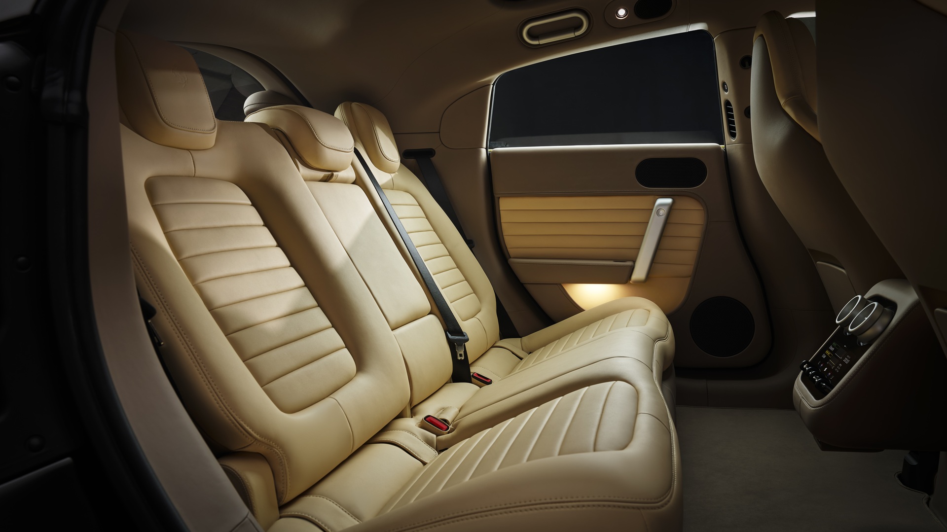 A studio shot of the Ferrari Luce in Giallo Luce shade, focusing on the rear seats