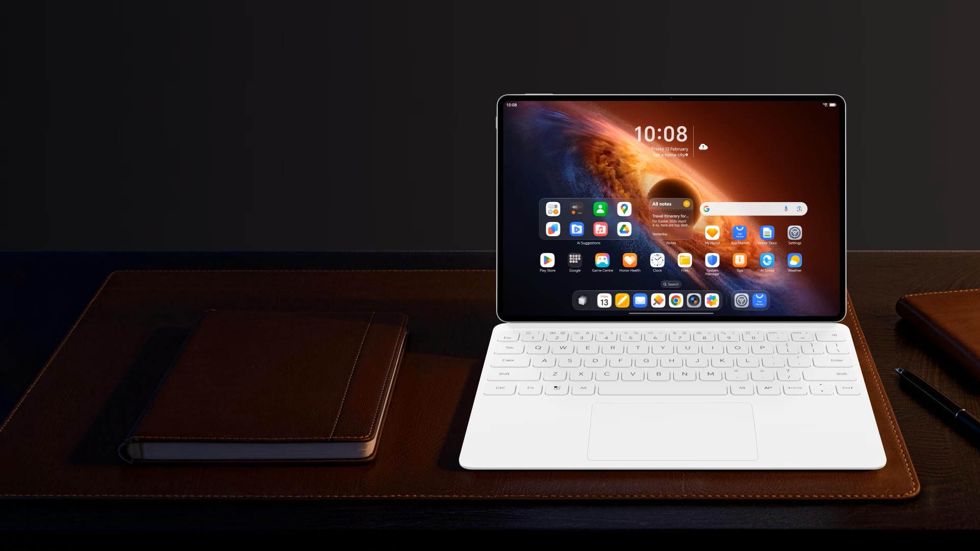 An HONOR MagicPad4, joined with a keyboard, kept on a table alongside a diary.