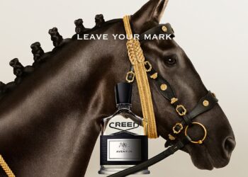An image of the Creed Aventus bottle placed next to a horse.