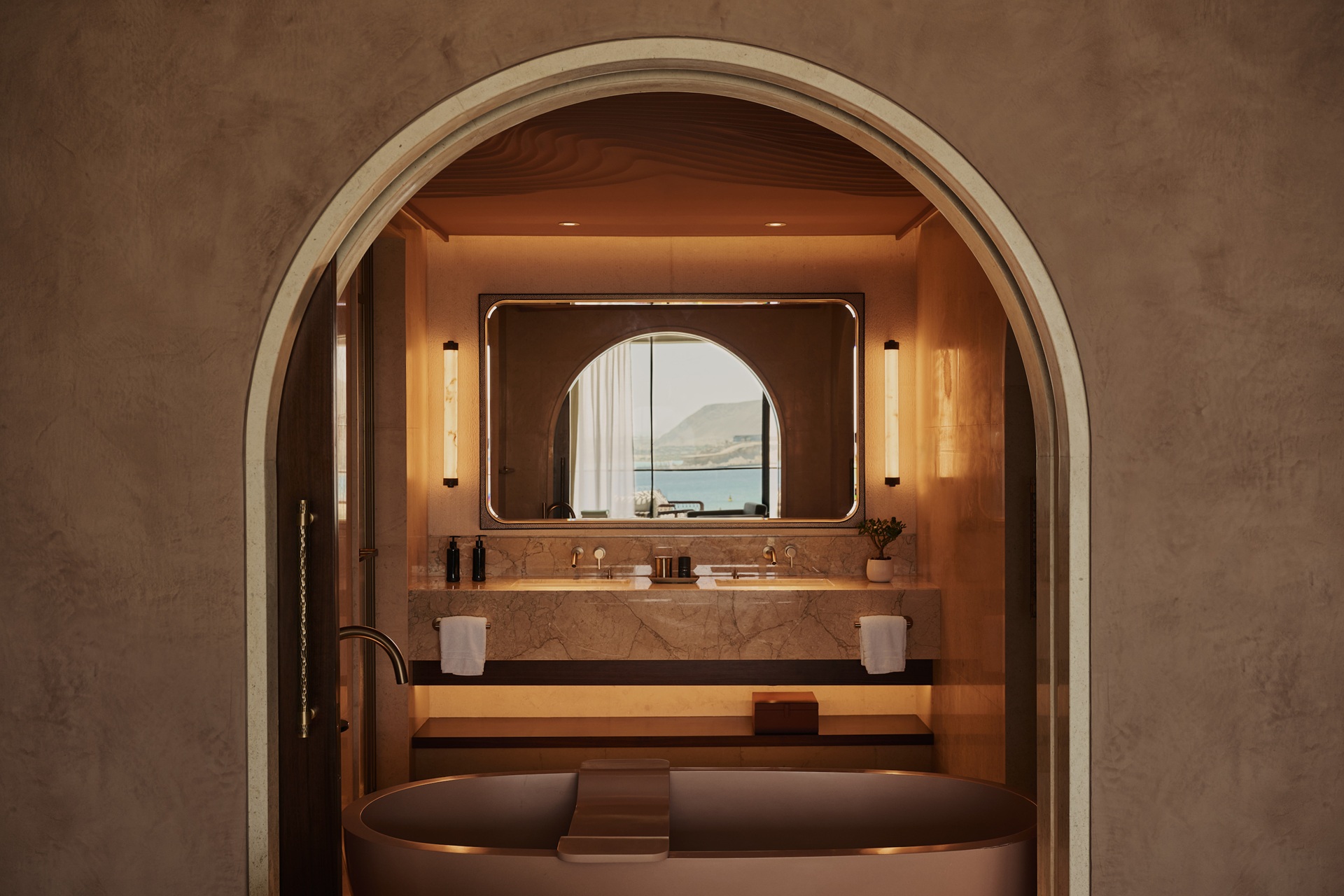 A section of the bathroom, with a bathtub, at the Four Seasons Resort and Residences AMAALA at Triple Bay