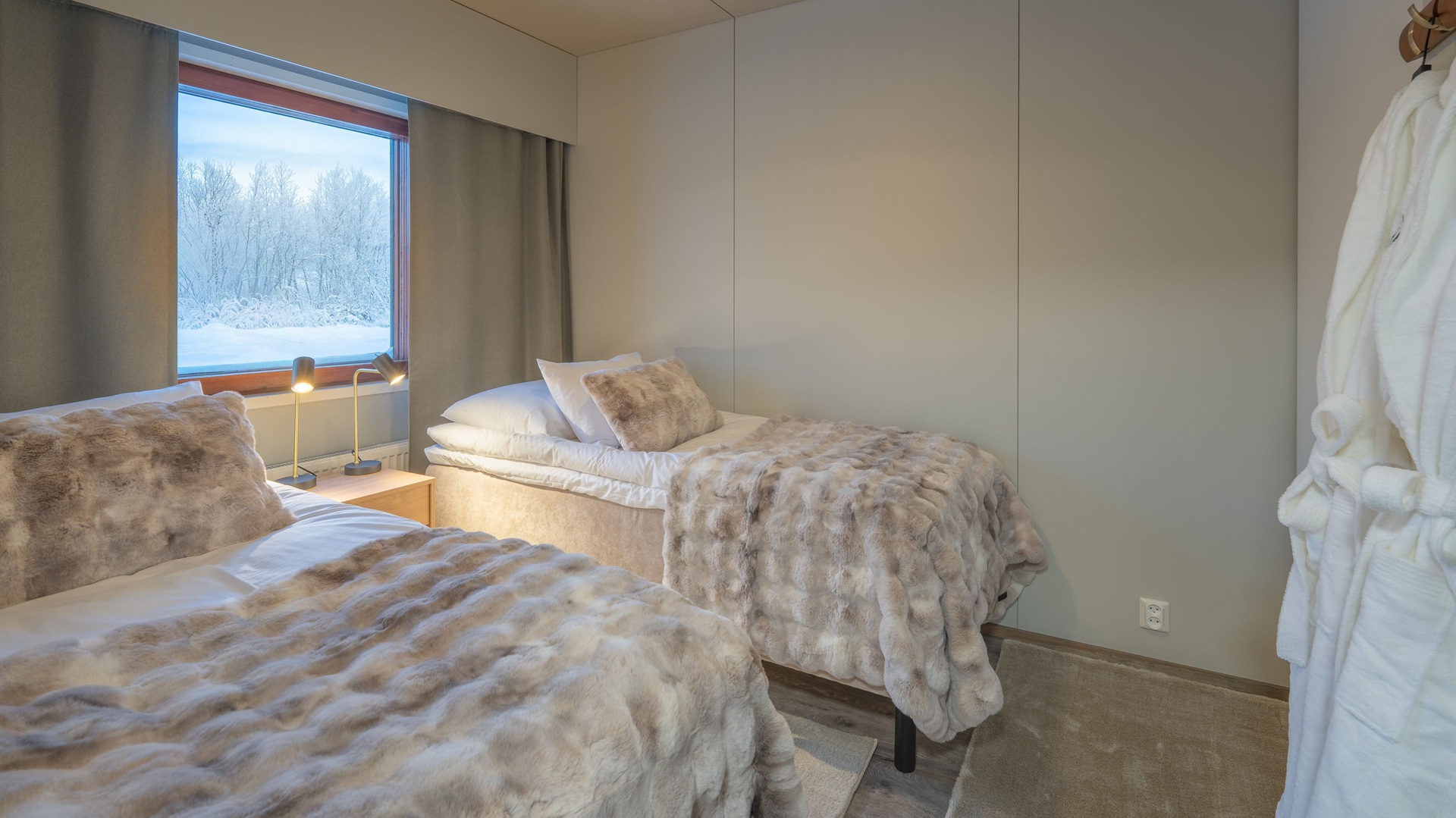 One of the bedrooms, with two single beds, at Octola III