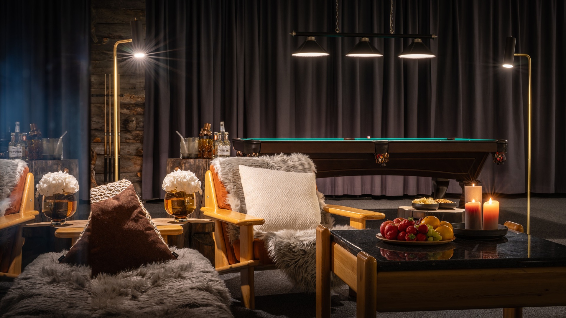 A common recreation area, with a pool table in the back, for guests at Octola III