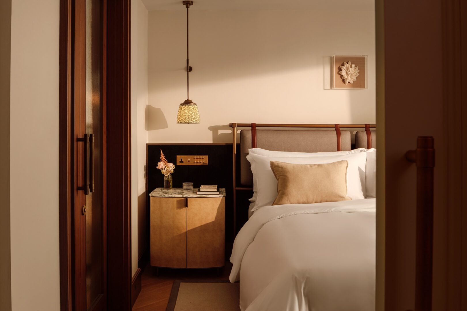 A close up of the bedside area inside the Junior Suite at St. Regis London