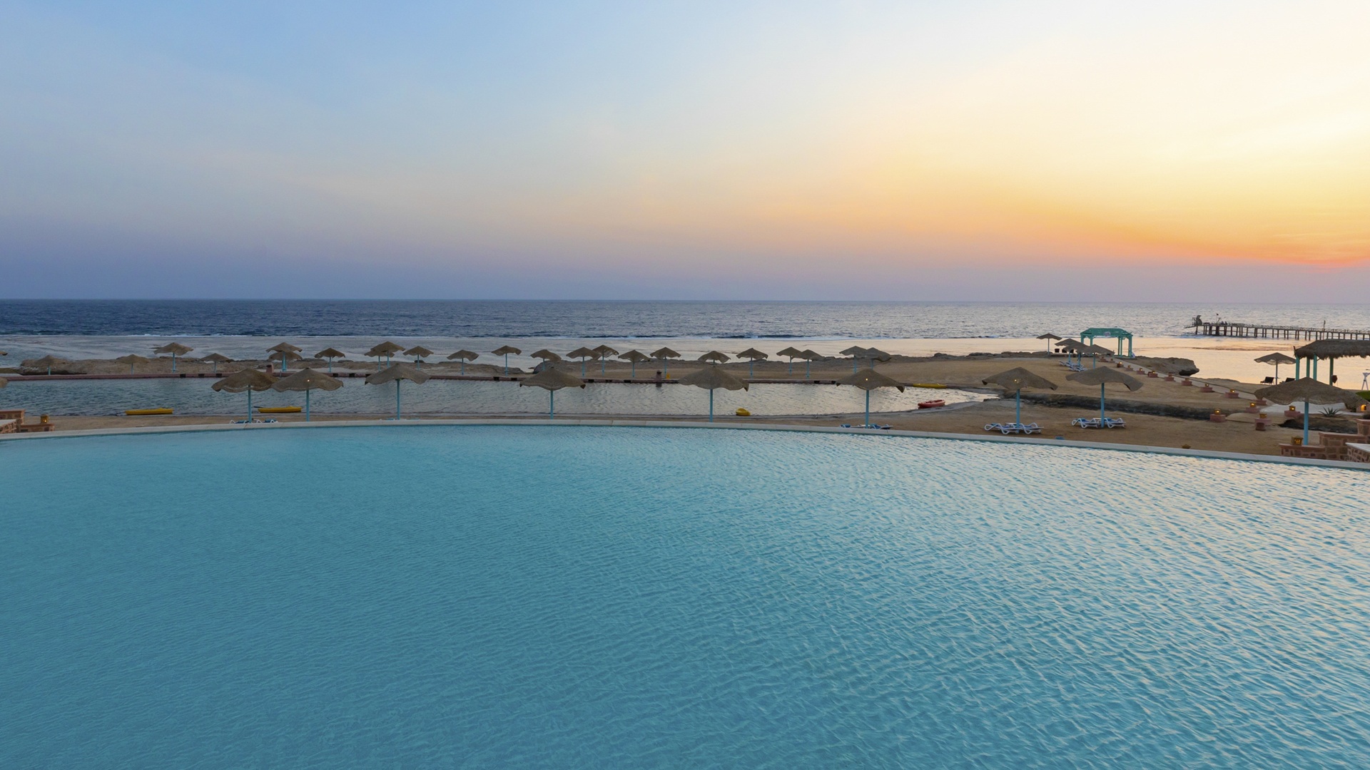 A wide shot of the beach-side at the Swissôtel Resort El Quseir in Egypt.