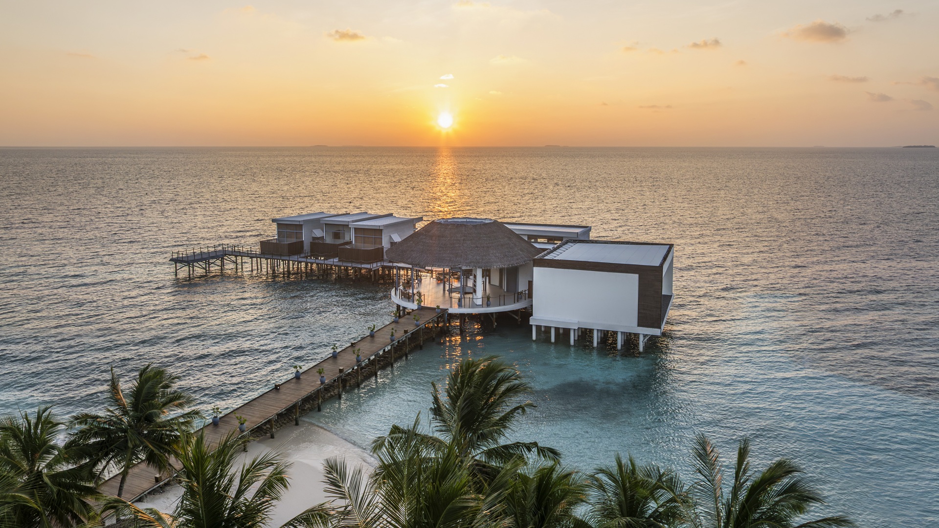 Sunrise captured with an aerial shot at The Halcyon Private Isles Maldives