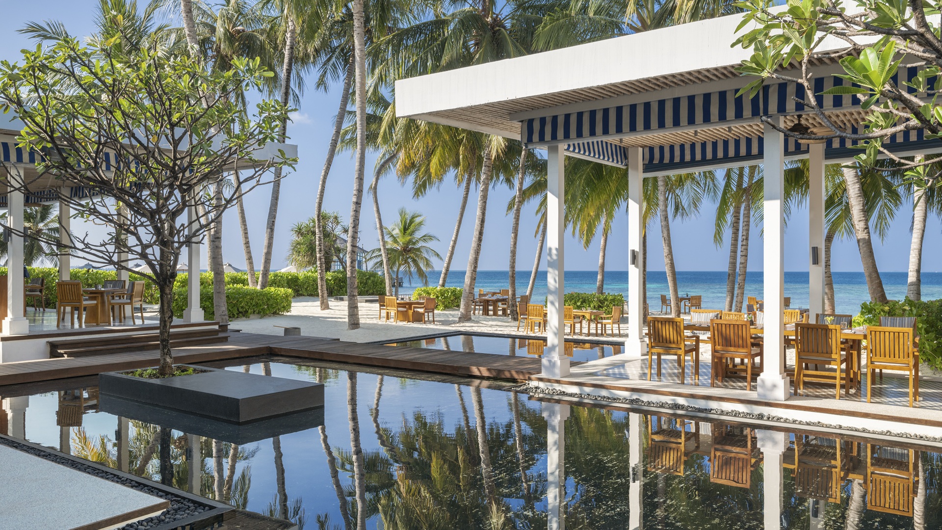 Thari, a restaurant that serves Asian and Mediterranean dishes all day on the beach, at The Halcyon Private Isles Maldives