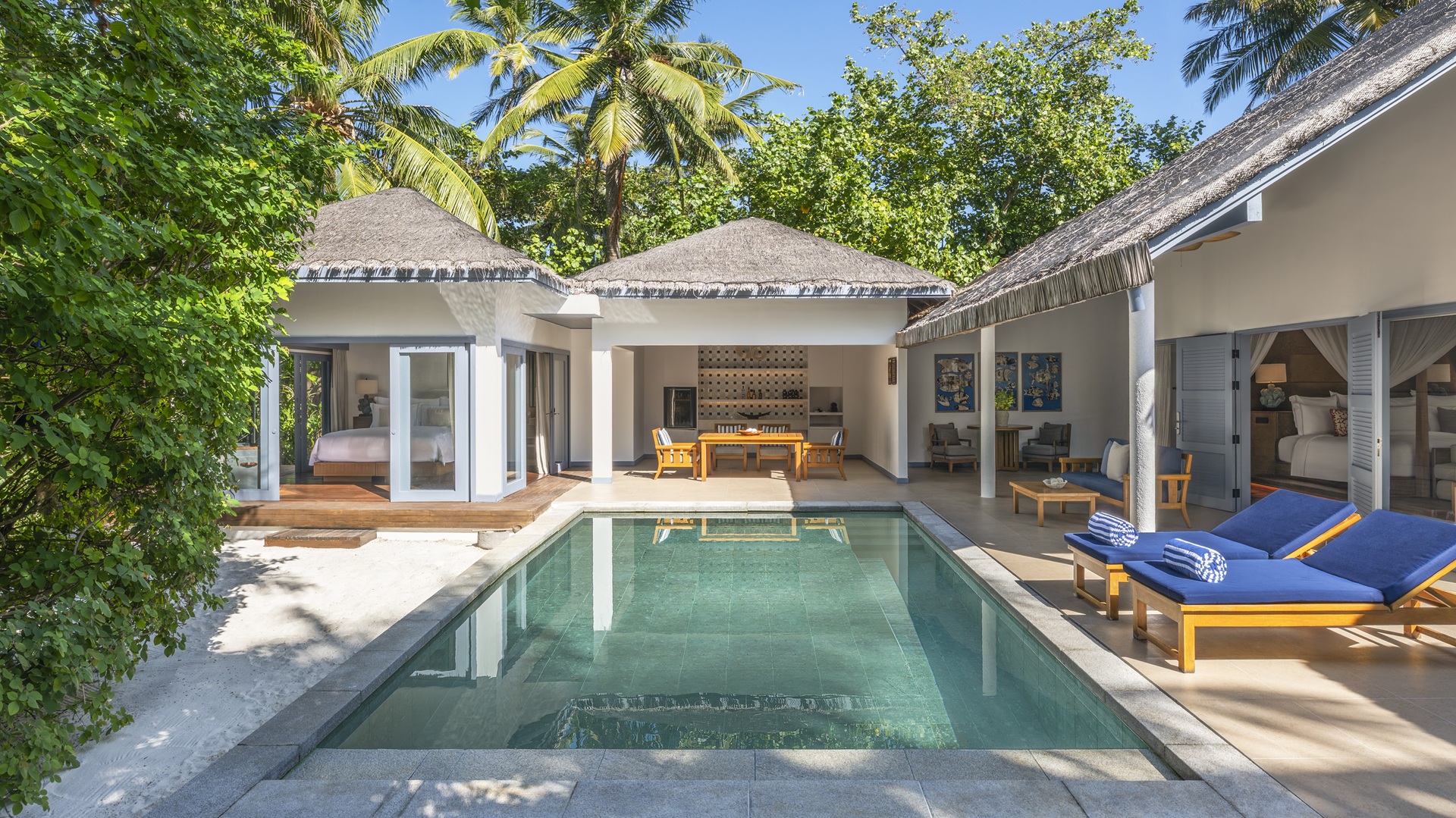 A shot of the private swimming pool area with a two-bedroom family villa at The Halcyon Private Isles Maldives