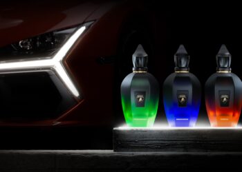 The complete Xerjoff Automobili Lamborghini Fragrance Collection, comprising Avanguardia, Fierezza, and Perseveranza, with a Lamborghini in the background