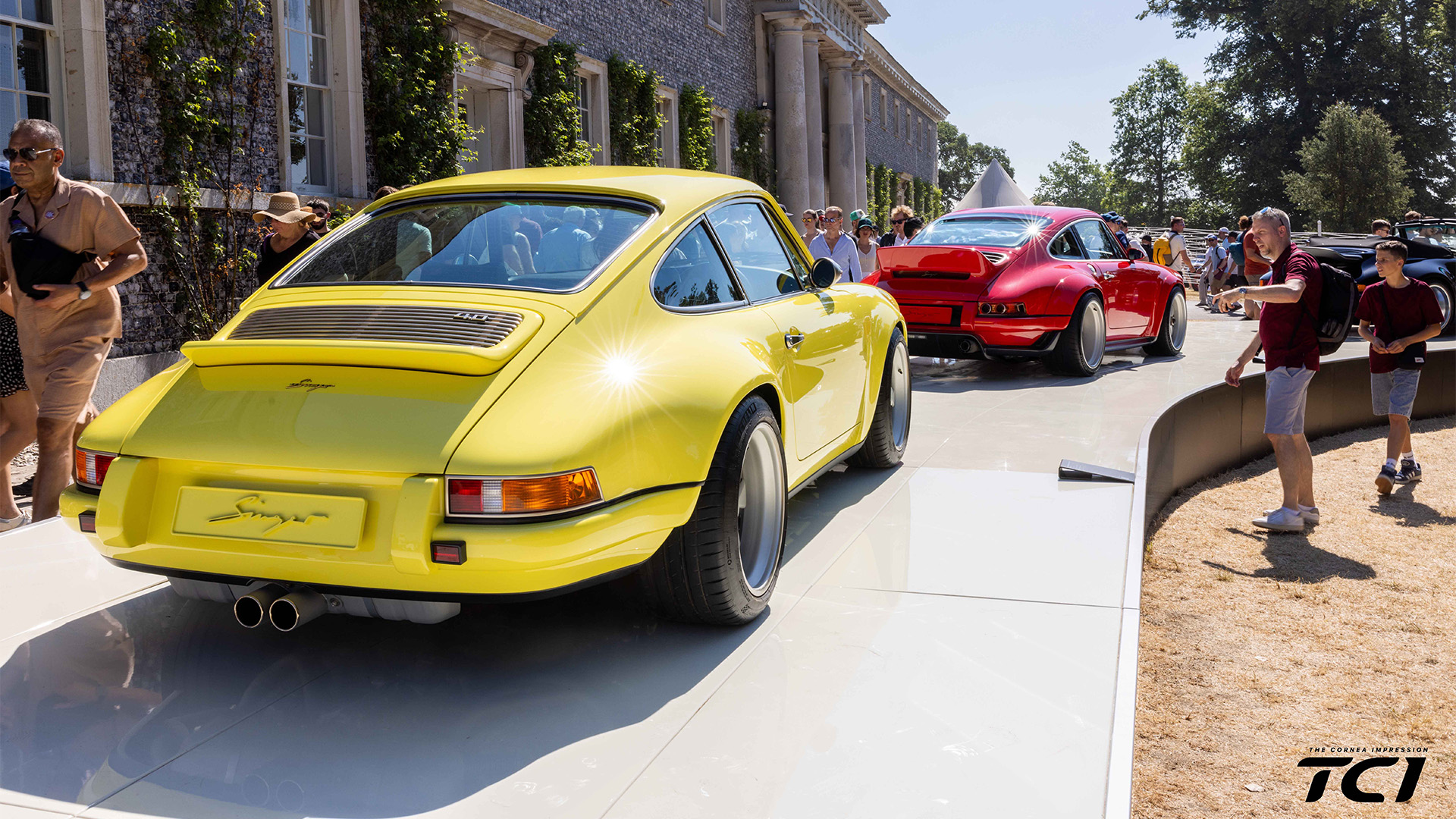 Yellow and Red Singer at the Singer Booth at the Goodwood Festival of Speed 2026
