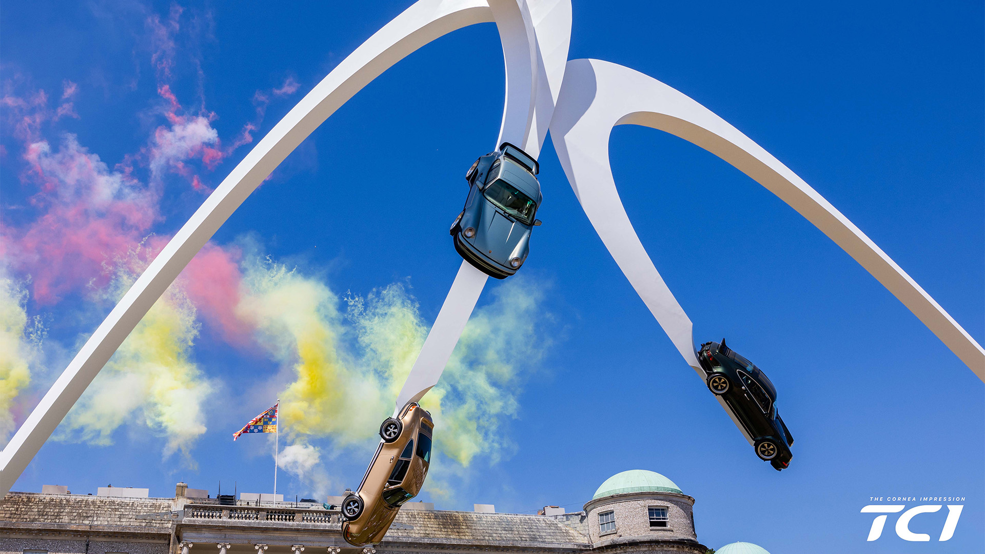 Singer Structure all three cars suspended in the air with fireworks in the background at the Goodwood Festival of Speed 2026