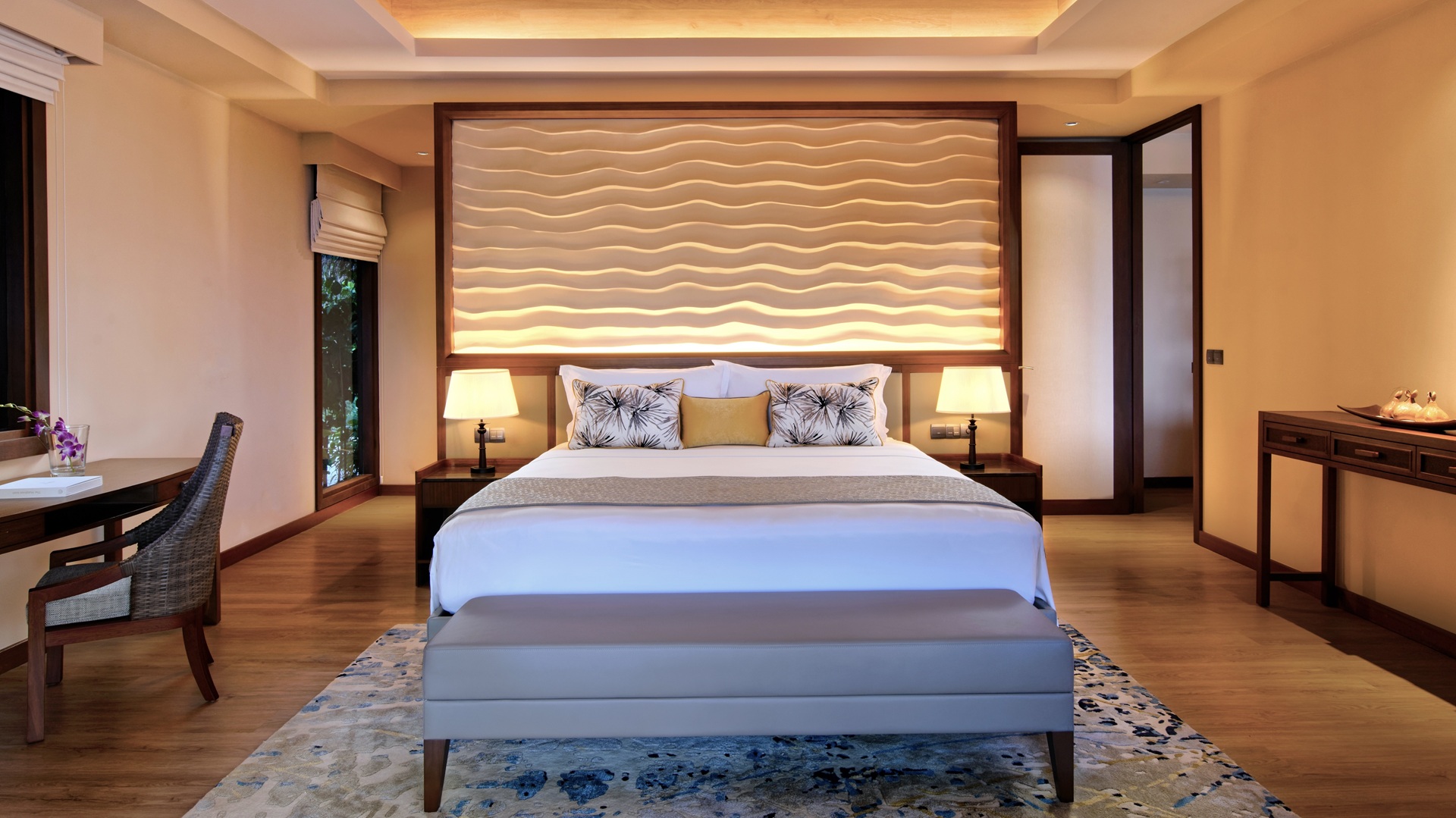 Shot of the bedroom inside a Baros Retreat villa, part of Baros Maldives Villas