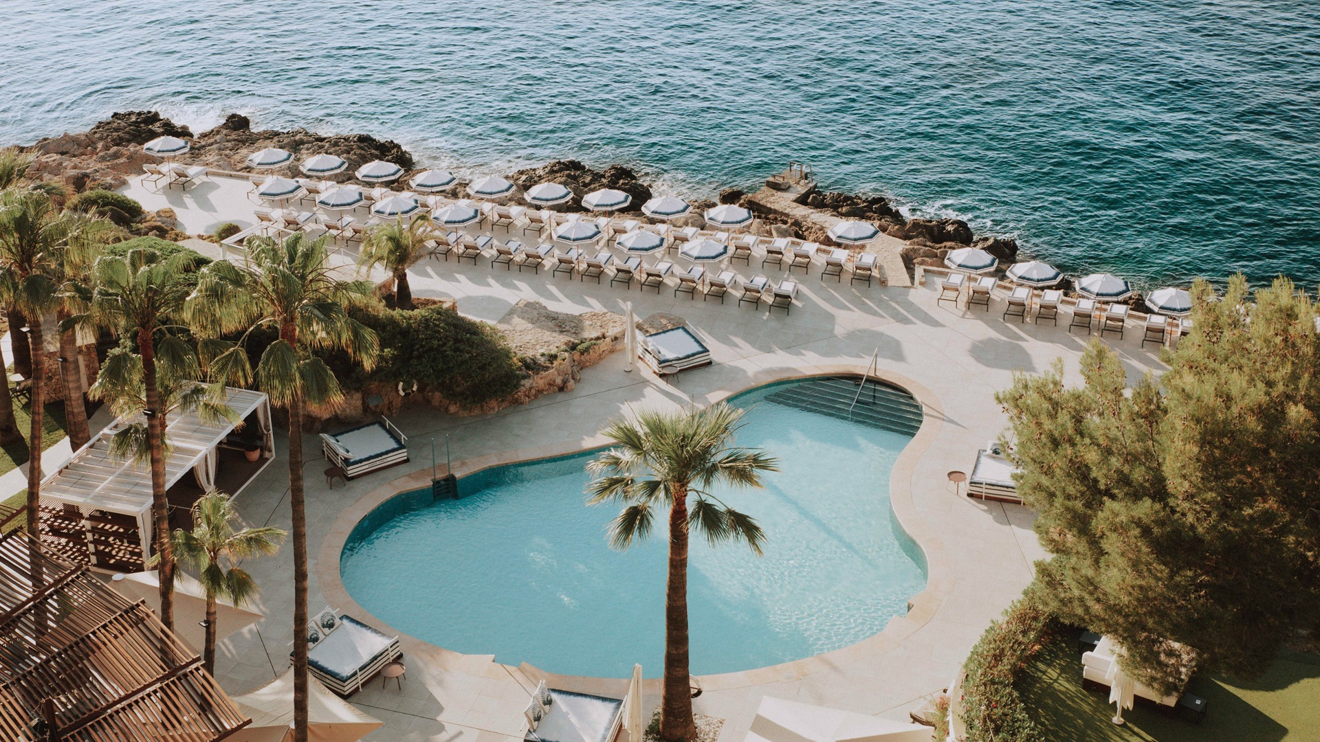 Gran Meliá Eclipse - an image taken from above of the Bombon Pool Club at Hotel de Mar