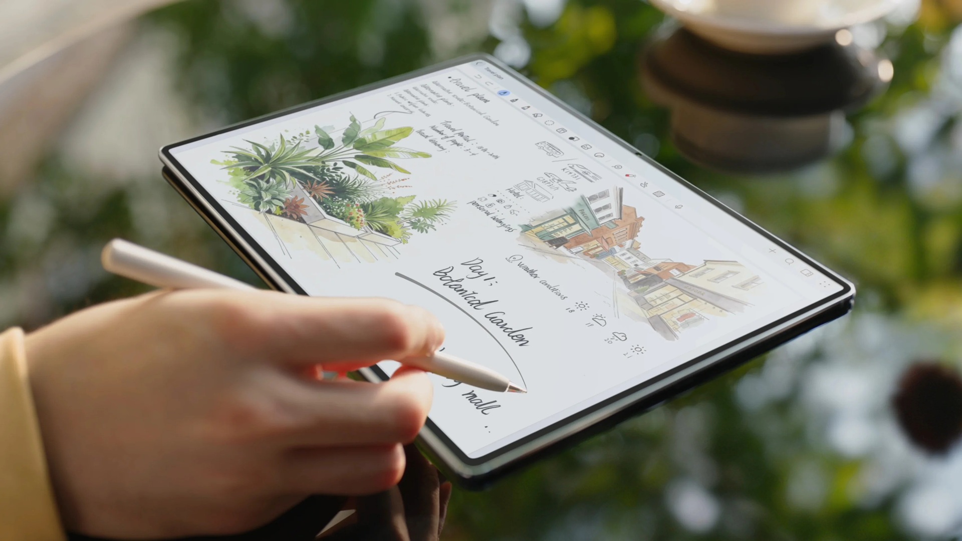 A HUAWEI MatePad Pro Max in use with the tablet kept screen-up on a table and the user holding the M-Pencil