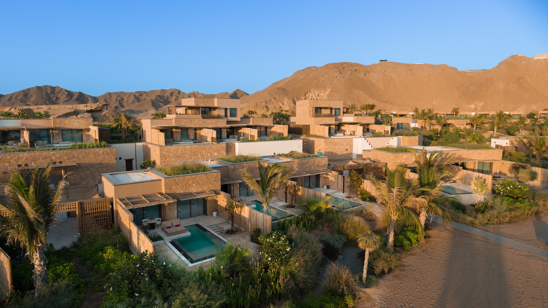 A shot capturing some of the rooms from the exterior at Six Senses AMAALA