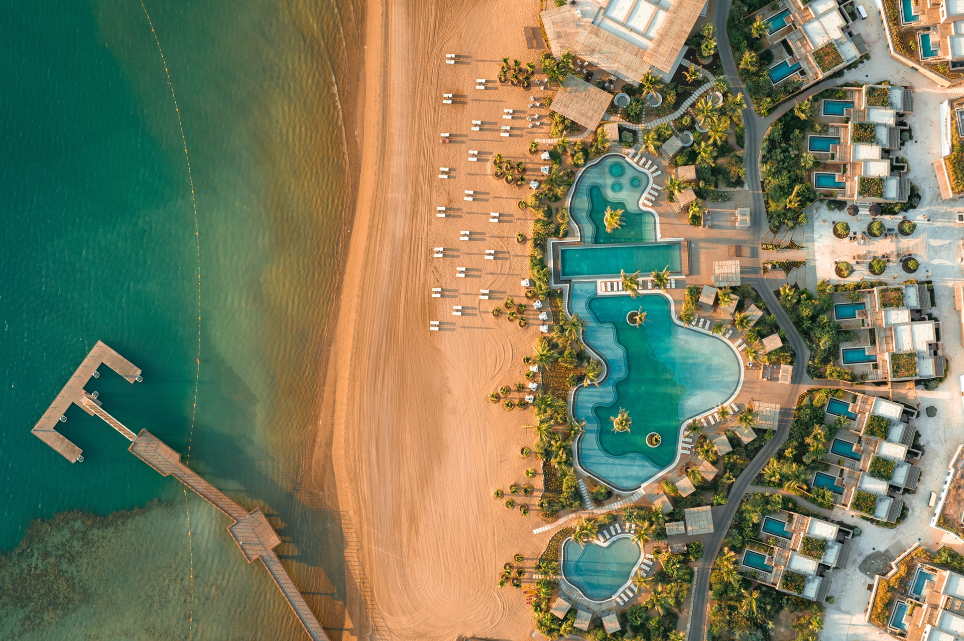 An aerial shot of the Six Senses AMAALA, next to the Red Sea coastline