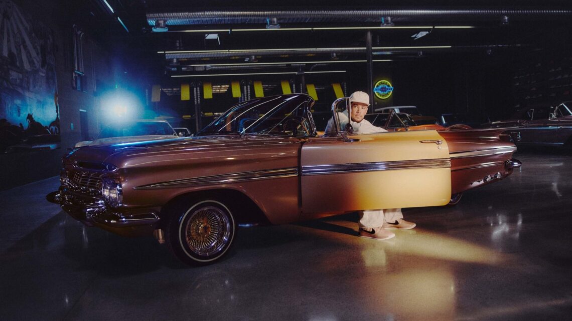 Nike Book 2: Devin Booker sitting in the driver’s seat of ‘Pretty Penny’, wearing Book 2 sneakers.