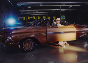 Nike Book 2: Devin Booker sitting in the driver’s seat of ‘Pretty Penny’, wearing Book 2 sneakers.