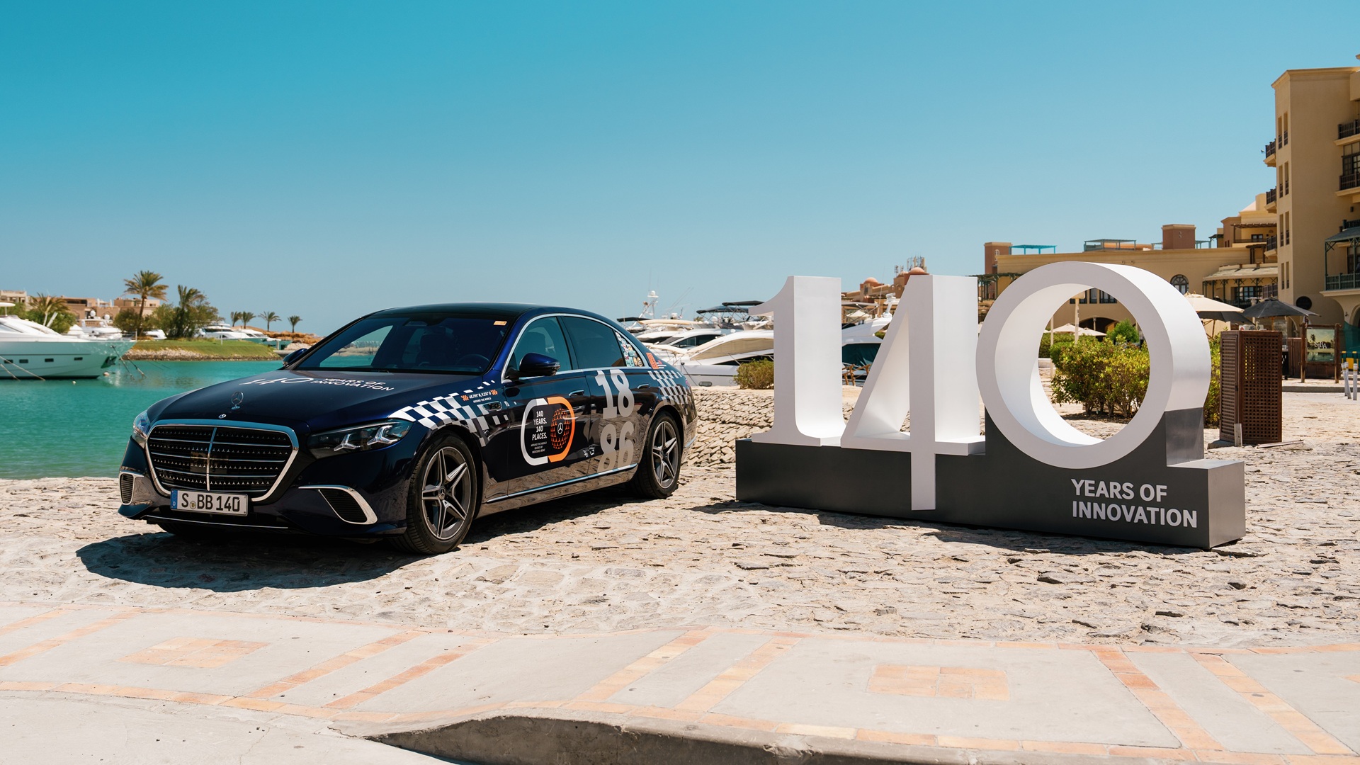 2026 Mercedes-Benz S-Class Review: A static image of the car on a beach.