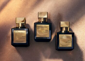 Maison Francis Kurkdjian Oud Velvet Mood: An image of three bottles kept side by side on what appears to be desert sand.