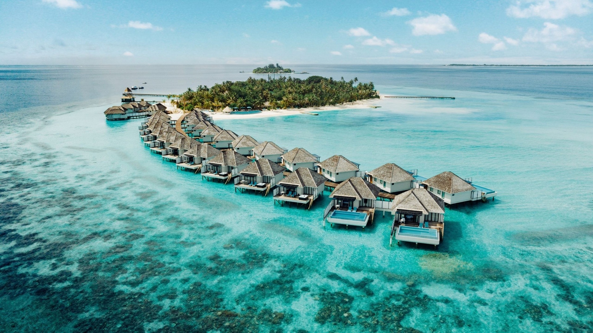 An wide-angle aerial shot of the Nova Maldives, with the villas in focus