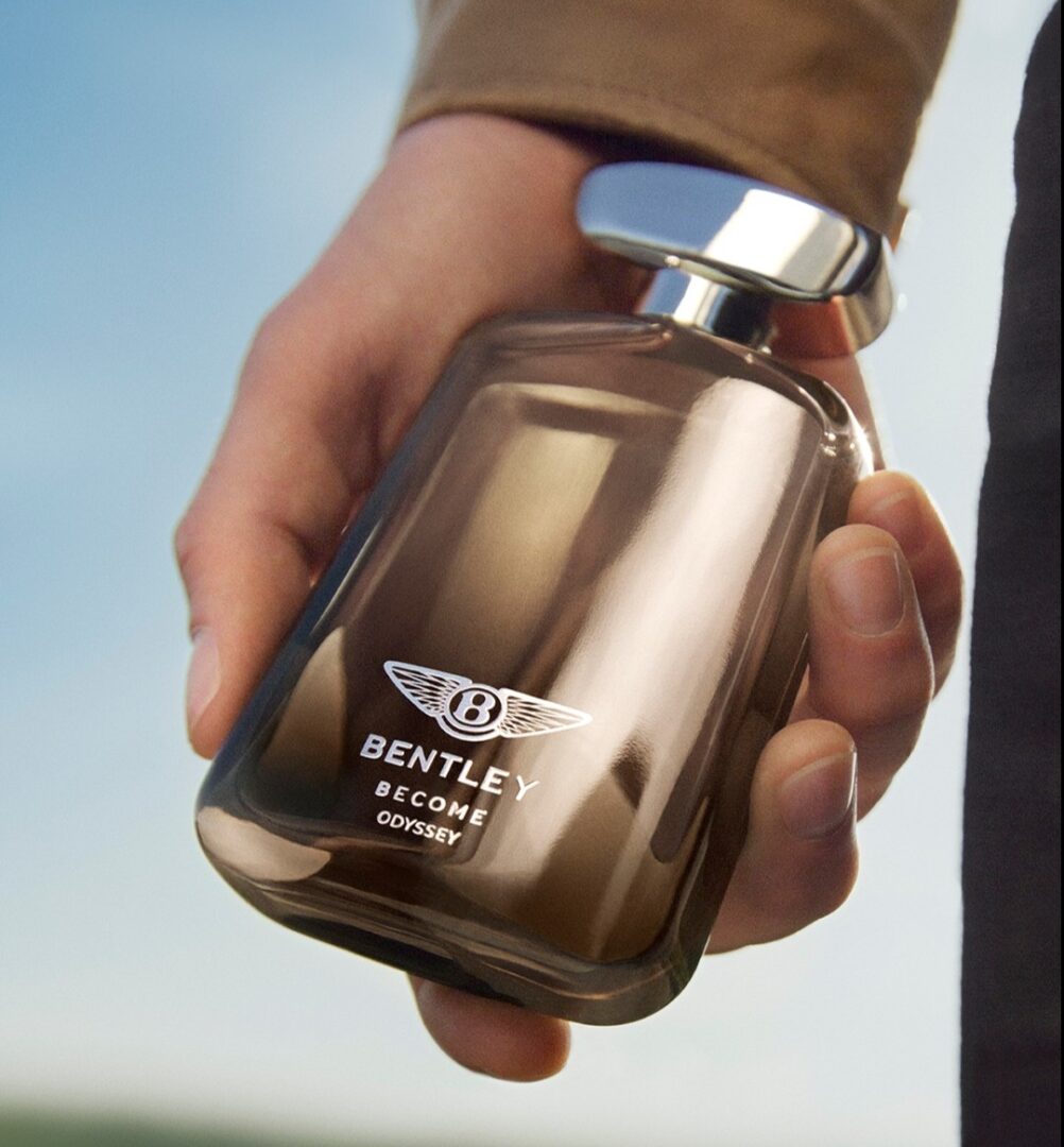 Bentley Become Odyssey: The bottle in a man's hand.