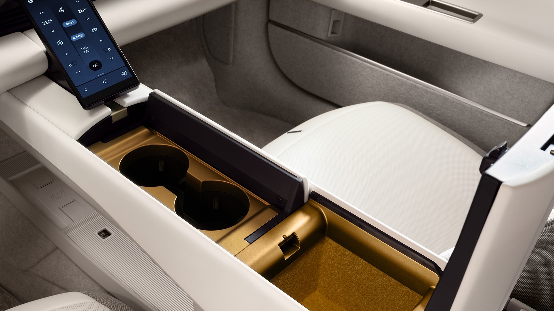 Jaguar Type 01 - An image of the centre console opened and revealing the storage space and cup holders