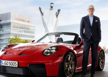 Porsche Strategy 2035: Dr. Michael, Chairman of the Executive Board of the Porsche AG, standing next to a red Porsche 911 Cabriolet